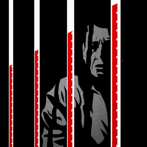 A man behind prison bars that are also thermometers with increasingly high temperatures