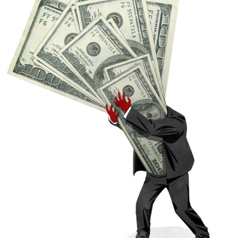 Red-handed businessman shoves oversized hundred dollar bills into his very being.